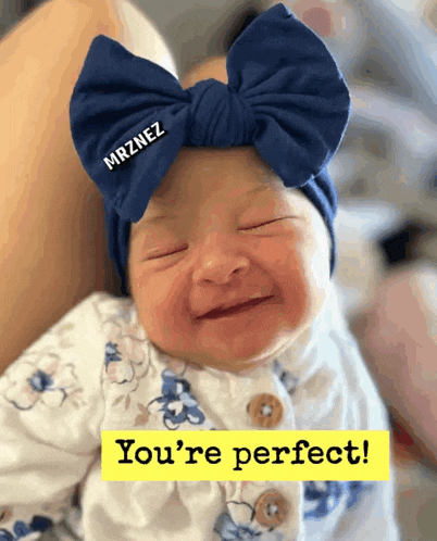 a baby wearing a blue headband that says mrznez