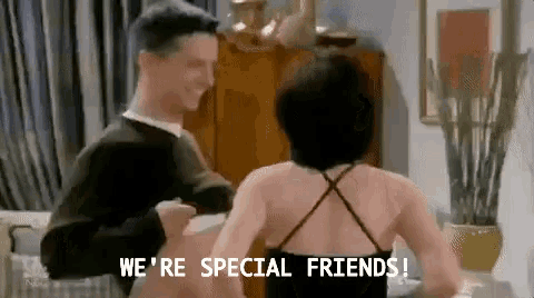 a man and a woman are dancing in a living room and the man is saying `` we 're special friends '' .