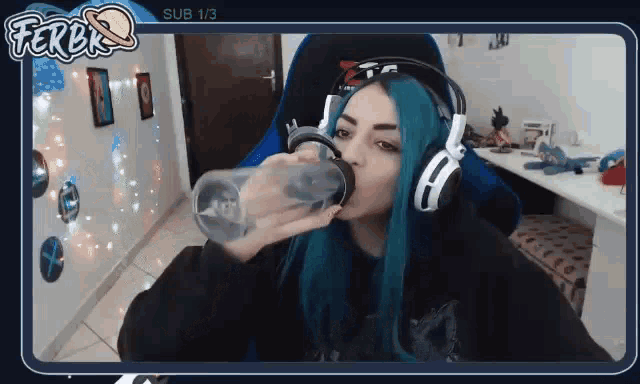 a girl with blue hair is drinking from a bottle with ferbk on the bottom