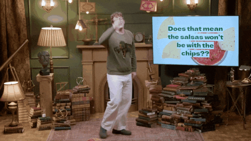 a man is dancing in front of a screen that says does that mean the salsas won t be with the chips
