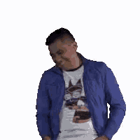 a man wearing a blue jacket and a white shirt is dancing .