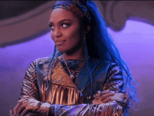 a woman with blue hair and braids is wearing a gold jacket
