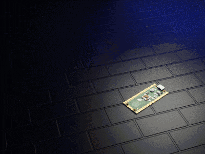 a small electronic device is laying on a black tile floor
