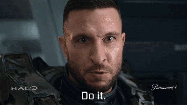 a man is wearing a halo armor and says do it