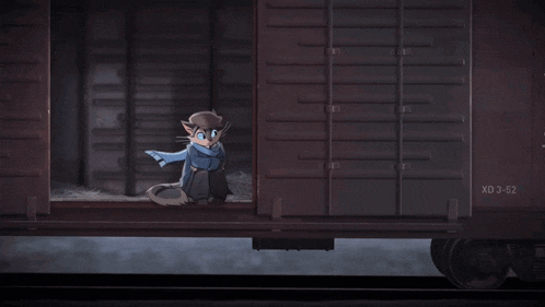 a cat in a hat and scarf is standing next to a train car that says xd 3-52