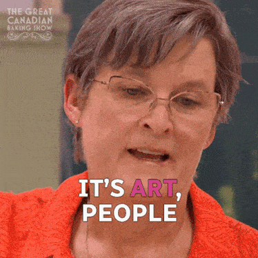 a woman says it 's art people while wearing glasses