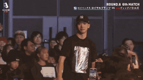 a man standing in front of a crowd with the words ace performer on the screen