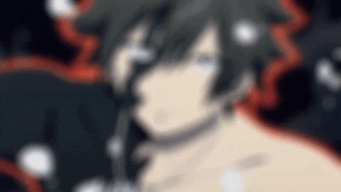 a blurry picture of a person 's face with a black background