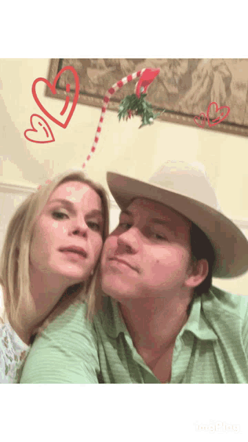 a man in a cowboy hat and a woman in a green shirt pose for a picture