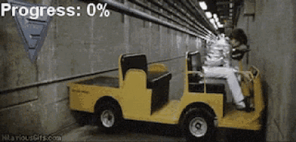 a man is driving a yellow vehicle in a tunnel with progress 0%
