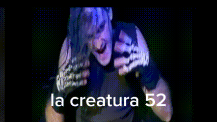 a man in a black shirt is standing in front of a sign that says la creatura 52