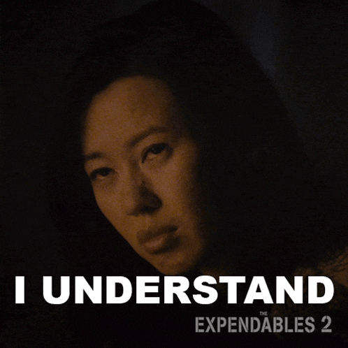 a poster for the expendables 2 with a woman in the dark