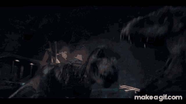 a dinosaur is laying on the ground with make a gif.com at the bottom of the screen