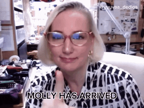 a woman giving a thumbs up with molly has arrived written underneath her