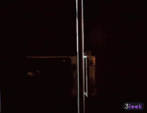 a man in a suit and tie is standing in a doorway with a 3look icon in the corner