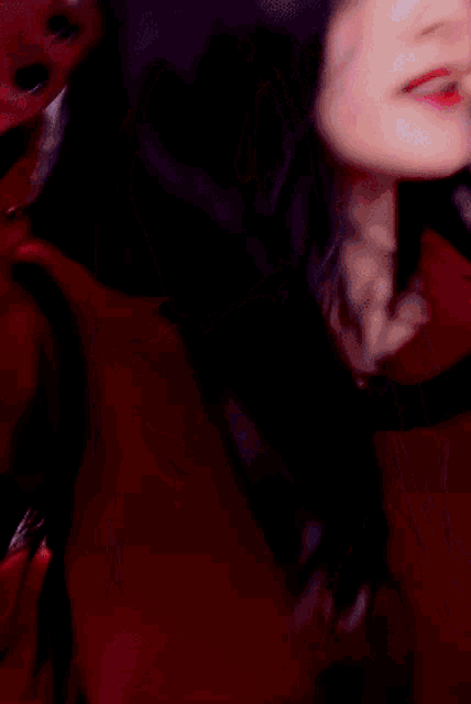 a close up of a woman 's face with her eyes closed and her mouth open