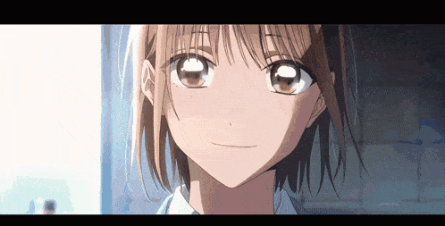 a close up of a girl 's face with a smile on it