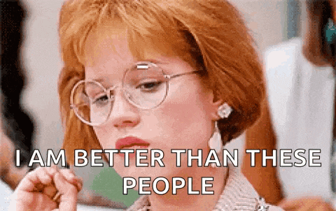 a woman wearing glasses and earrings is smoking a cigarette and saying `` i am better than these people '' .