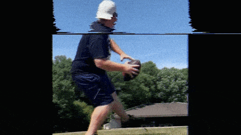 a man wearing a white hat is holding a football in his hands