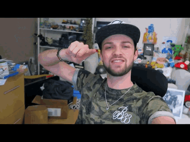a man with a beard wearing a hat and a shirt that says b88