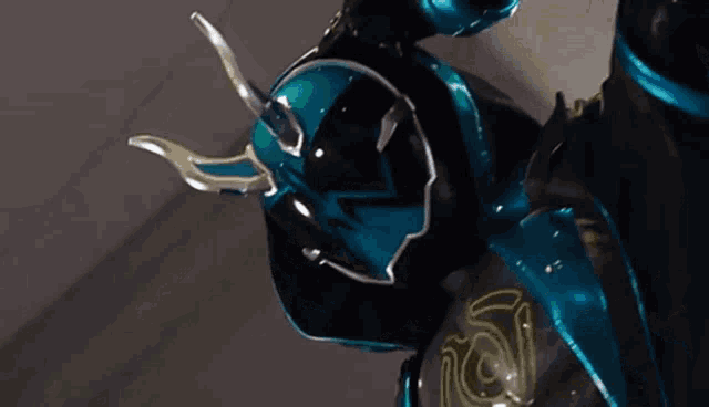 a close up of a person wearing a helmet with horns on it .