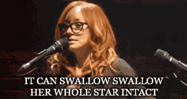a woman singing into a microphone with the words " it can swallow swallow her whole star intact " below her