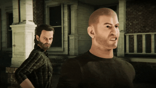 a man with a beard and a man with a bald head are standing next to each other