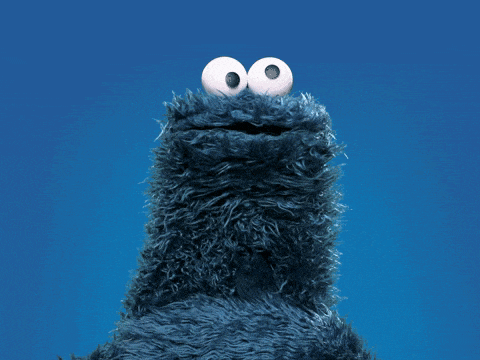 cookie monster from sesame street looks up into the sky
