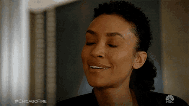 a close up of a woman 's face with the hashtag #chicagofire on the bottom