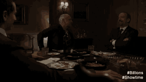 a group of men are sitting around a table and one of them says something is just actually wrong