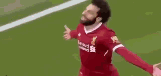 a blurry picture of two soccer players on a field .