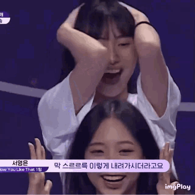 two girls are laughing with their hands in their hair and a sign that says imgplay on it