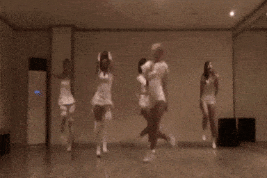 a group of women are dancing in a dance studio