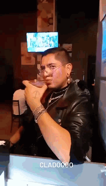 a man in a leather jacket is making a funny face and the word clad0000 is visible in the corner