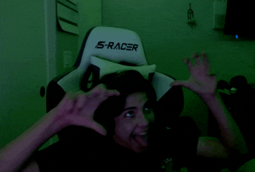 a person in a s-racer chair making a face
