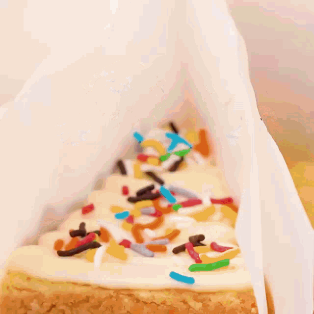 a slice of cake with different toppings and sprinkles