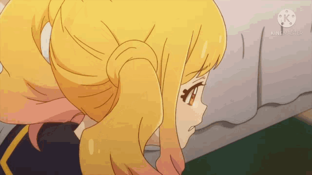 a close up of a girl 's face with a ponytail