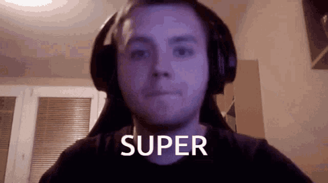 a man wearing headphones with the word super written on his face