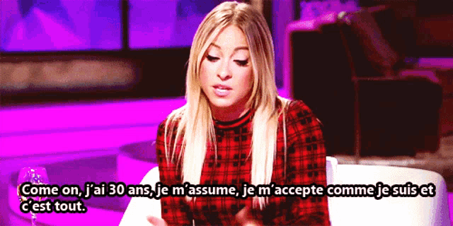 a woman in a plaid shirt says come on