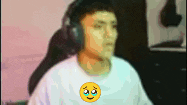 a man wearing headphones and a white shirt with an emoji on it