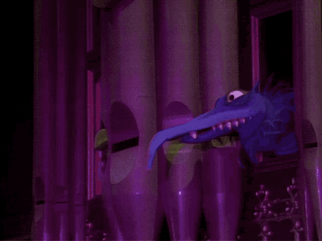 a blue monster and a green monster are behind a purple pipe