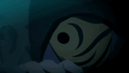 a person is standing in the dark with a light coming out of their face .