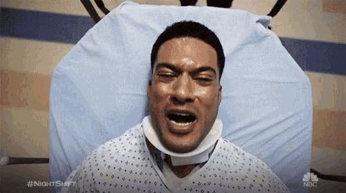 a man is laying in a hospital bed with his mouth open and #nightshift written on the bottom