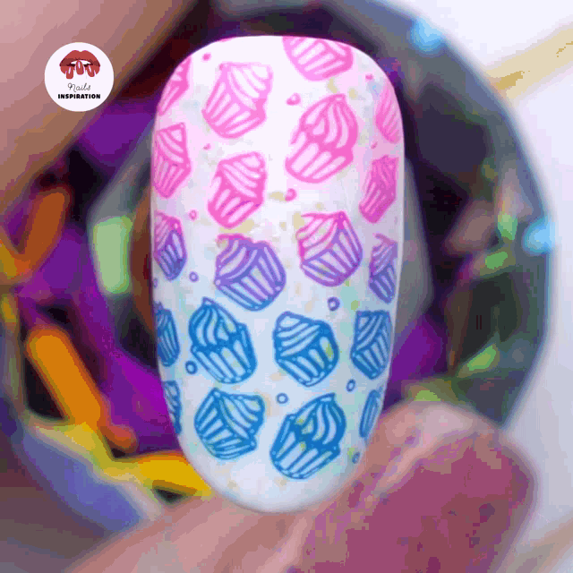 a close up of a nail with pink and blue cupcakes on it and the words kylie inspiration on the bottom
