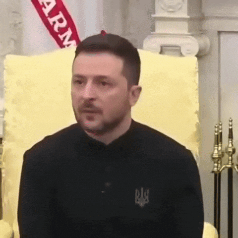 a man is sitting in a chair with a flag behind him that says army