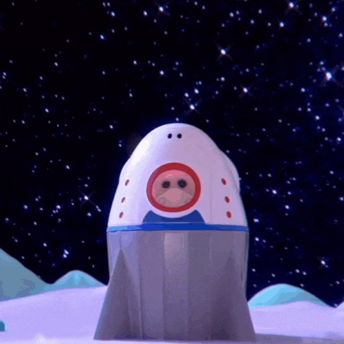 a stuffed animal is standing in front of a space ship
