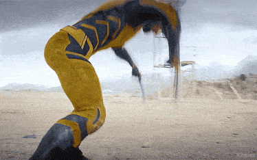 a person in a yellow and black superhero costume is standing in a desert with kepler written on the bottom