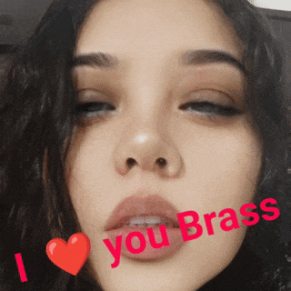 a close up of a woman 's face with the words " i love you brass " on her face