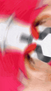 a close up of a pair of pliers on a red surface