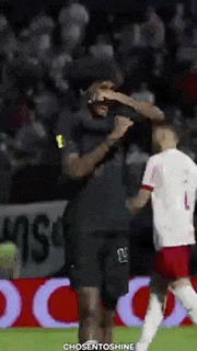 a soccer player with the number 1 on his jersey is being hugged by another player